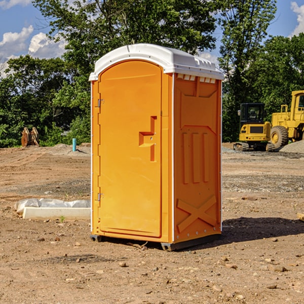 what is the cost difference between standard and deluxe portable restroom rentals in Luana IA